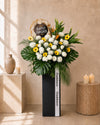 Tribute Condolences Flower Stand with yellow gerberas, white roses and spider mums, front view