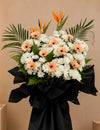 Forever Beyond Condolences Flower Stand with peach gerberas and bird of paradise, full arrangement