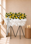 Brightwood Serenity Condolences Flower Stand with yellow papermums and green pom poms, full arrangement