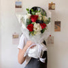 Close-up of Hera Red Rose Eustoma Bouquet showing premium red roses and soft pink eustoma flower details