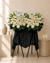 Claire Condolences Flower Stand with white spider mums and cream gerberas, close-up of blooms