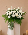 Fading Bloom Condolences Flower Stand with white papermums, ping pongs and matthiola, close-up of blooms